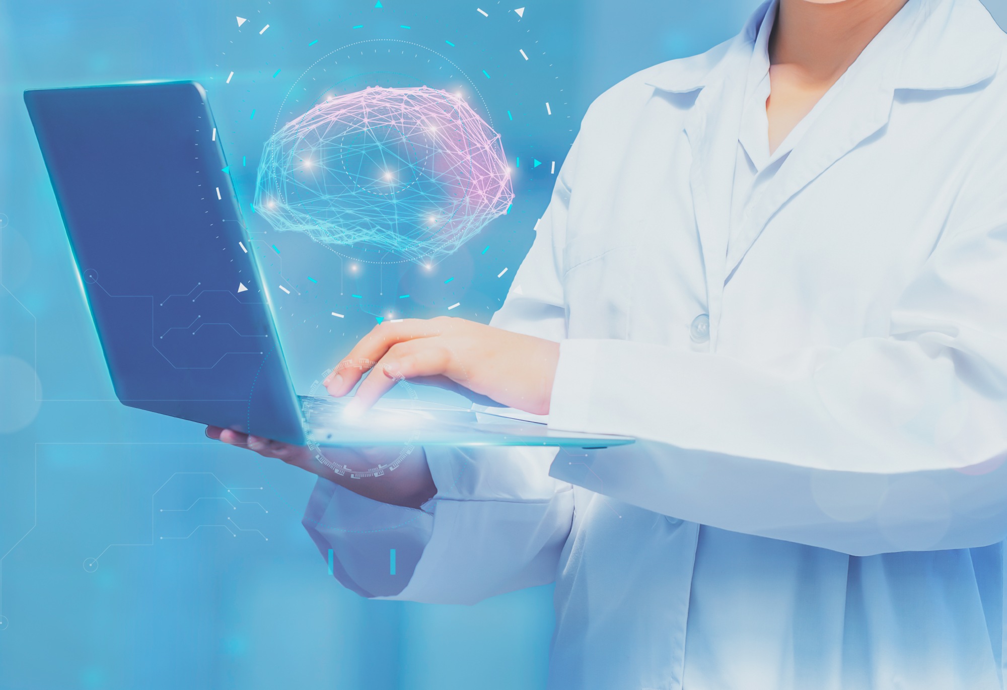 Woman doctor holding futuristic computer with virtual screen interface holographic digital brain on laptop,concept digital healthcare connection and medical innovative technology and science